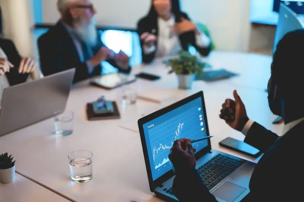 Current image: Investor reviewing portfolio balance during market volatility to manage risk and returns